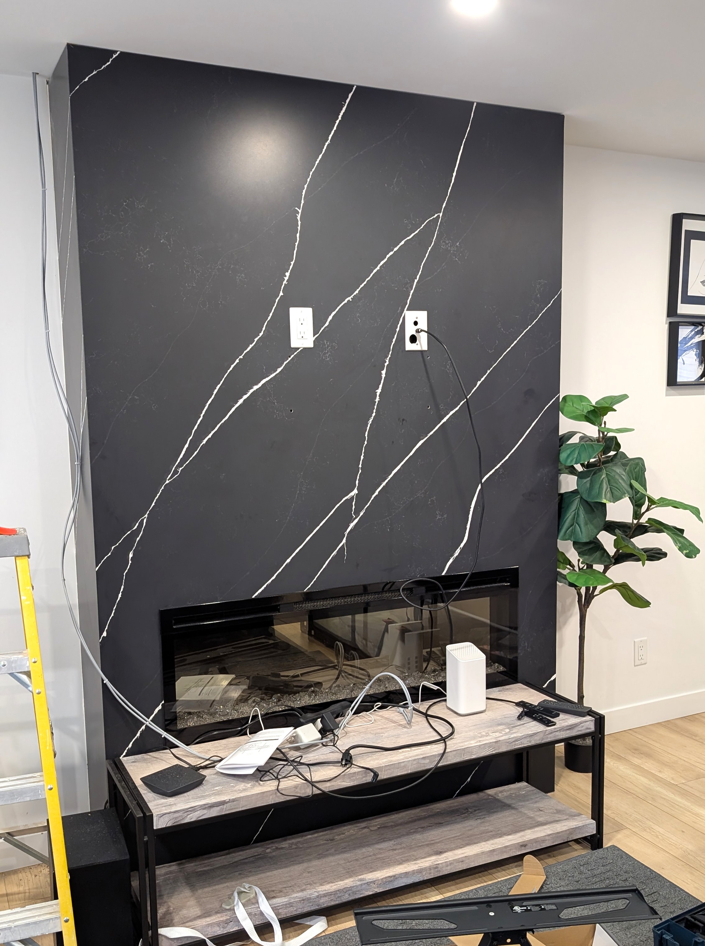 Before photo of a 62-inch TV mounting job in Calgary NE.