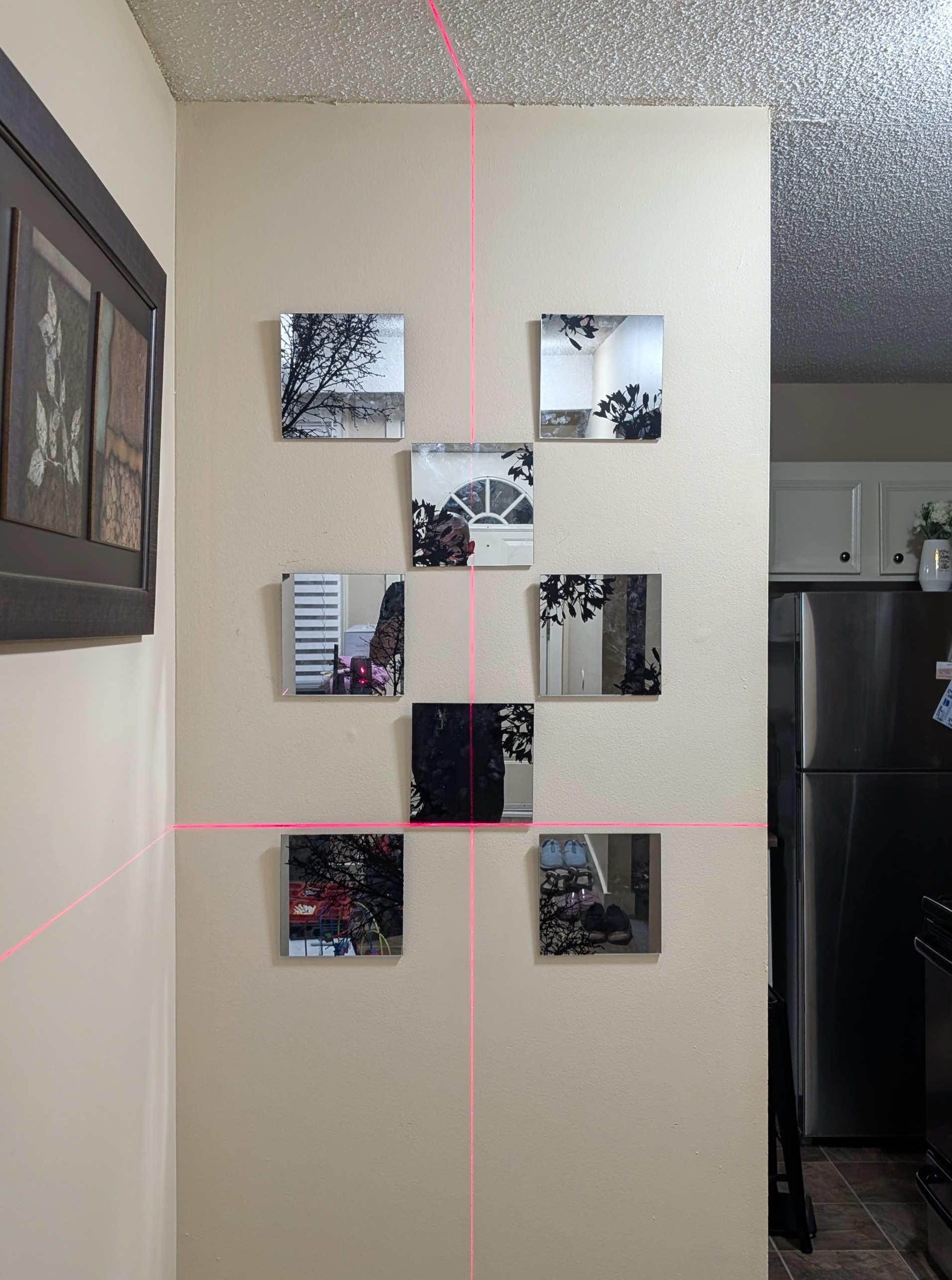 Set of small mirrors installed as wall decor in Calgary.