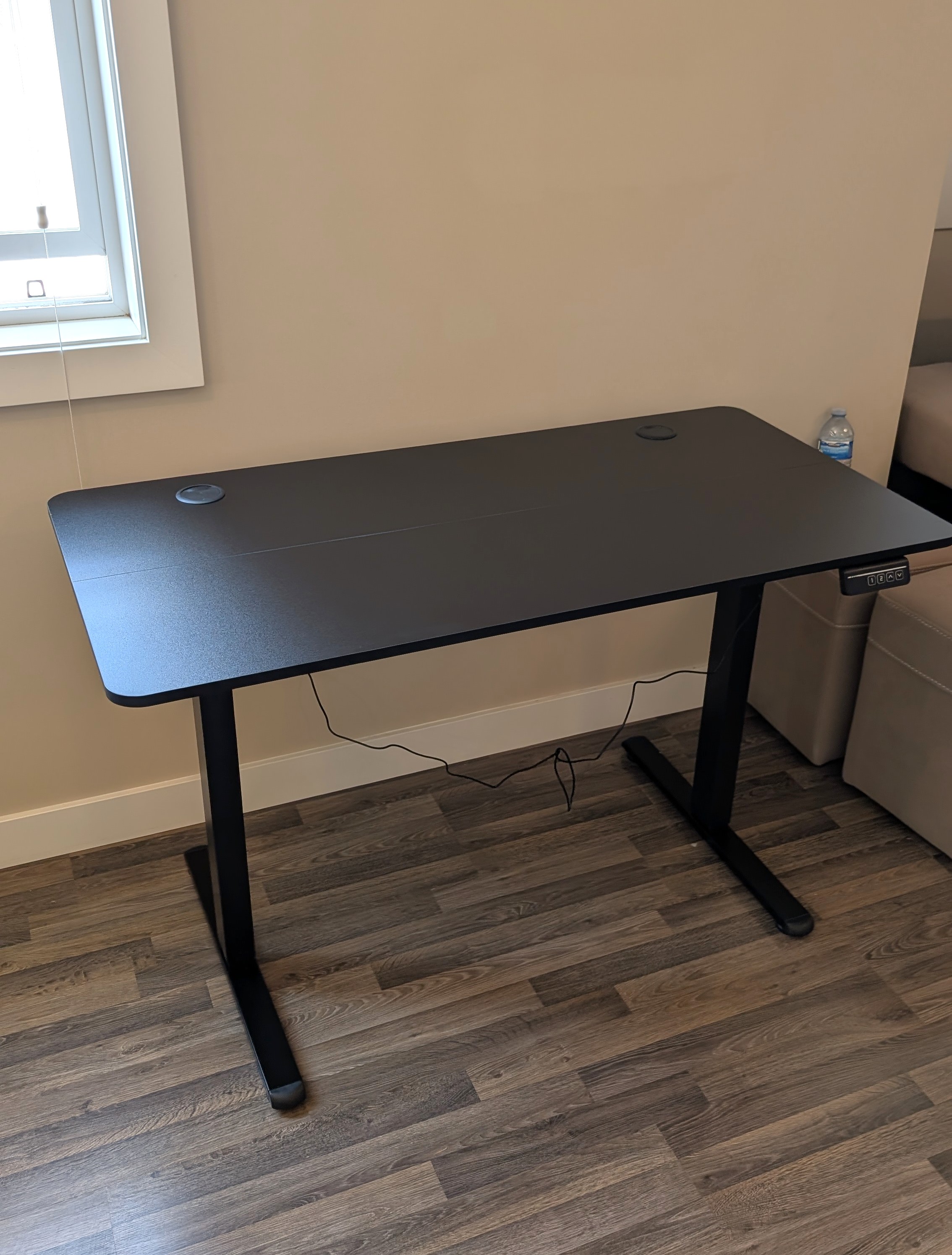 Adjustable-height computer desk assembled.