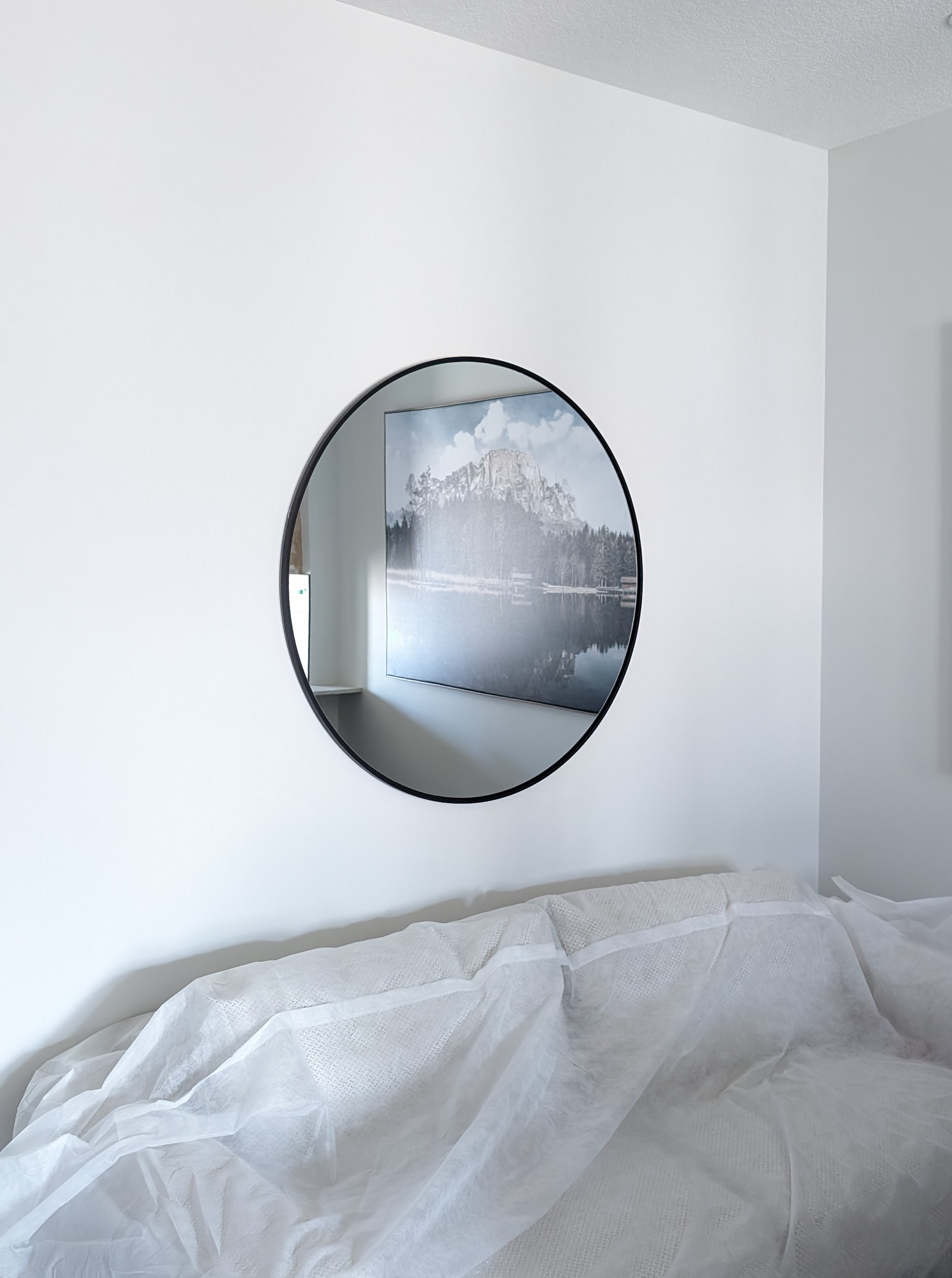 Round mirror mounted in Calgary NW.