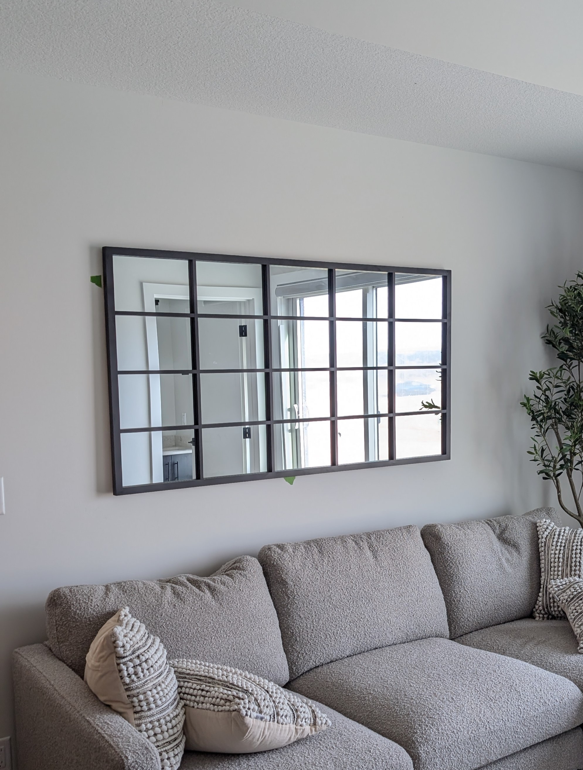 Windowpane mirror mounted in Calgary NW.