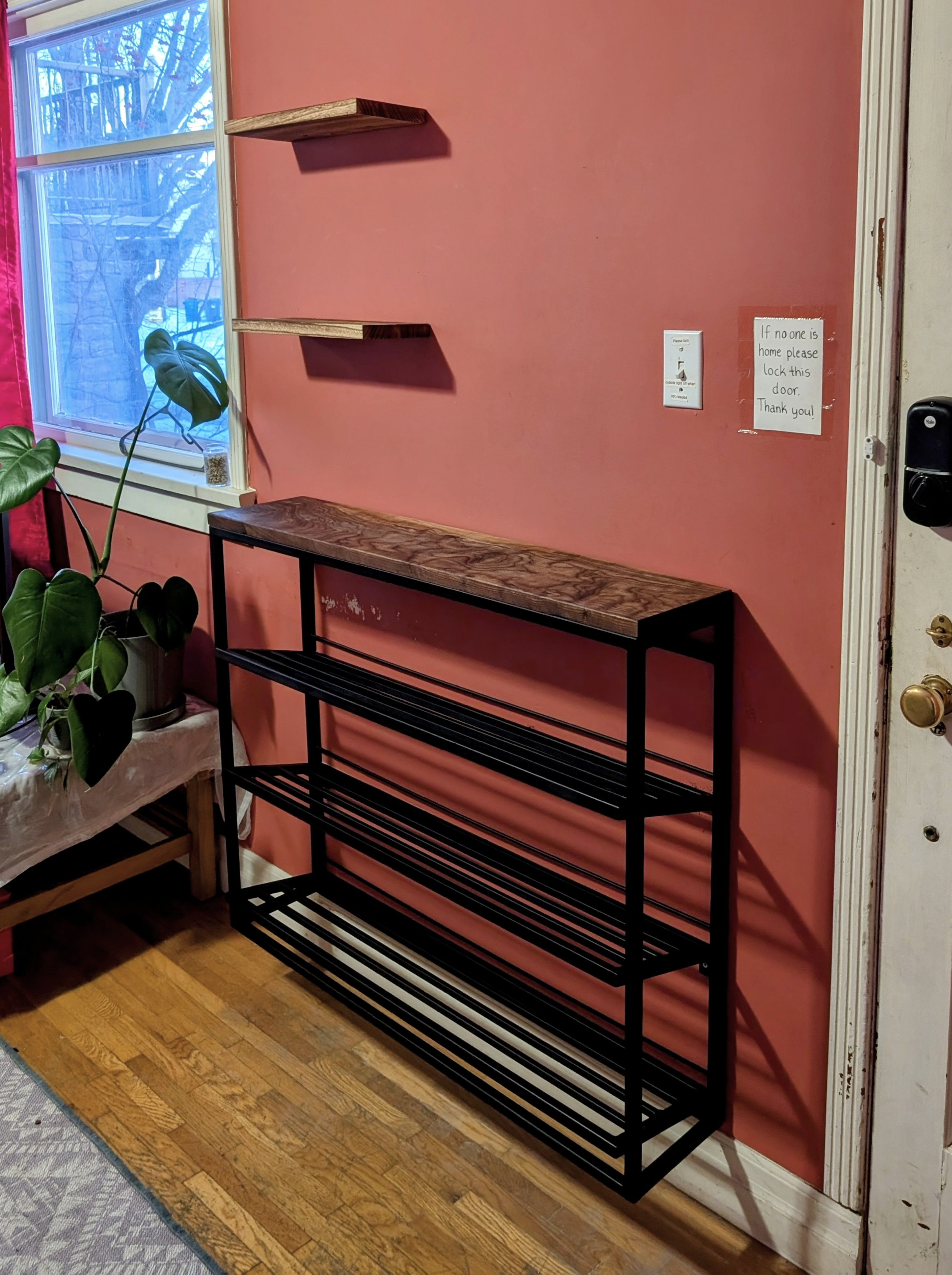 Custom shoe rack and floating shelves mounted in Calgary SE.